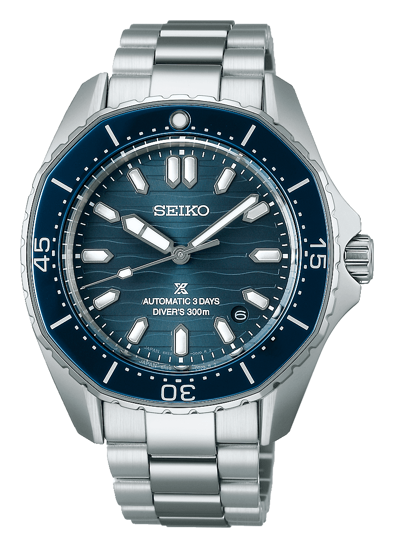 Seiko Prospex SPB483J1 with a teal-blue dial patterned with waves, a double marker at 12, a date between 4 and 5 and a polygonal blue bezel, on a steel bracelet